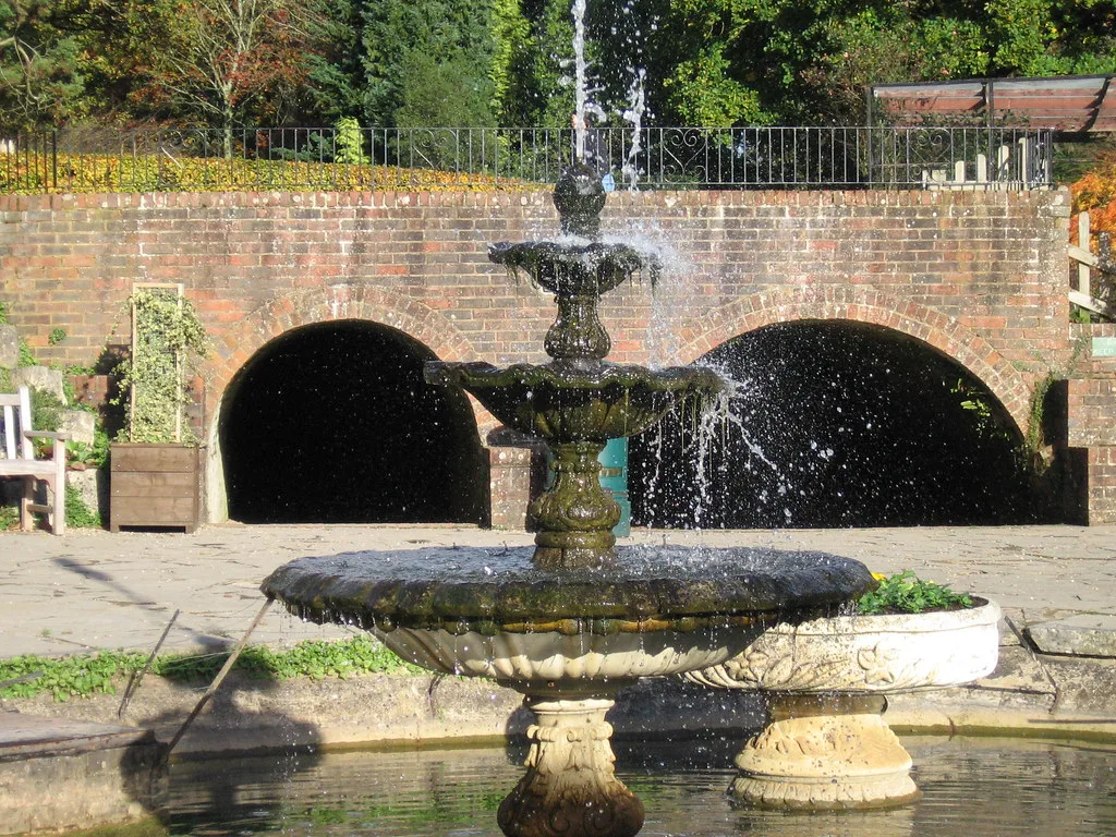 Fountain in goldfish pond at Paultons Park